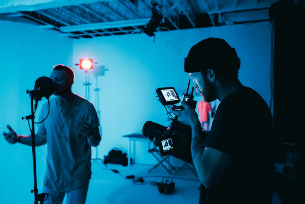 Cinematographer filming a branded story with a professional camera